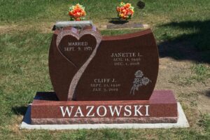 A granite headstone with details.